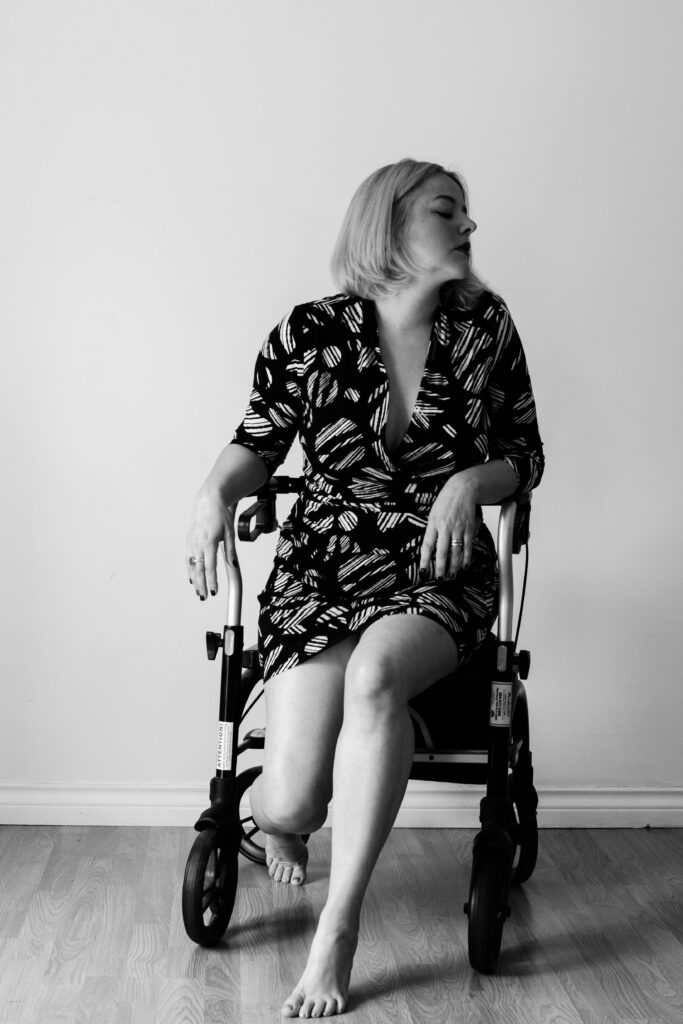 Woman sitting on a walker, looking to the side in disgust
