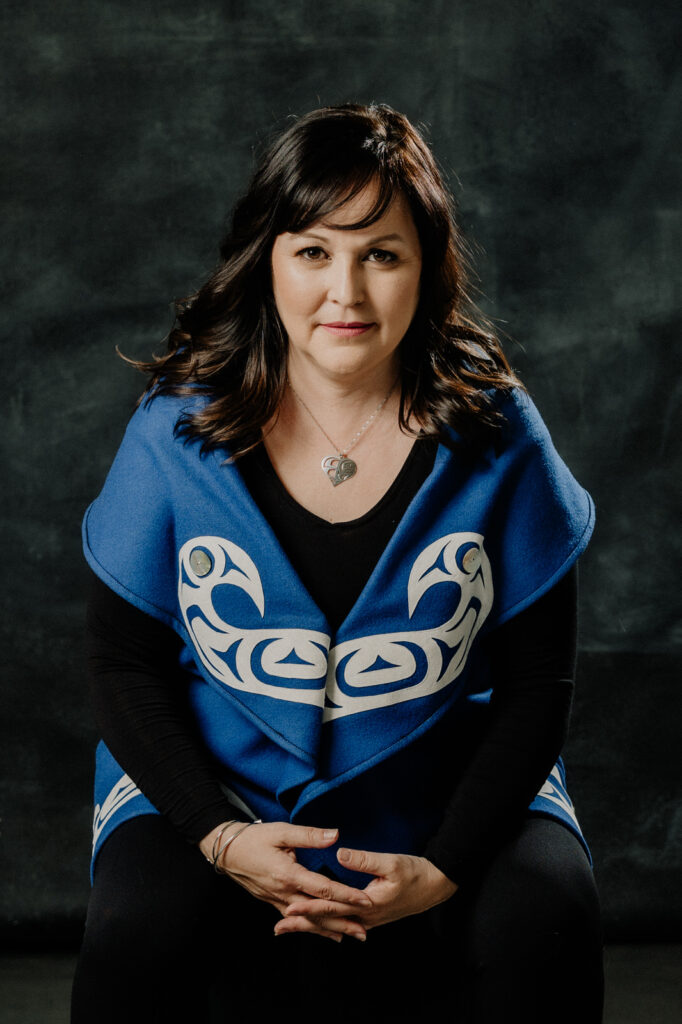Headshots image of a woman in an indigenous wrap
