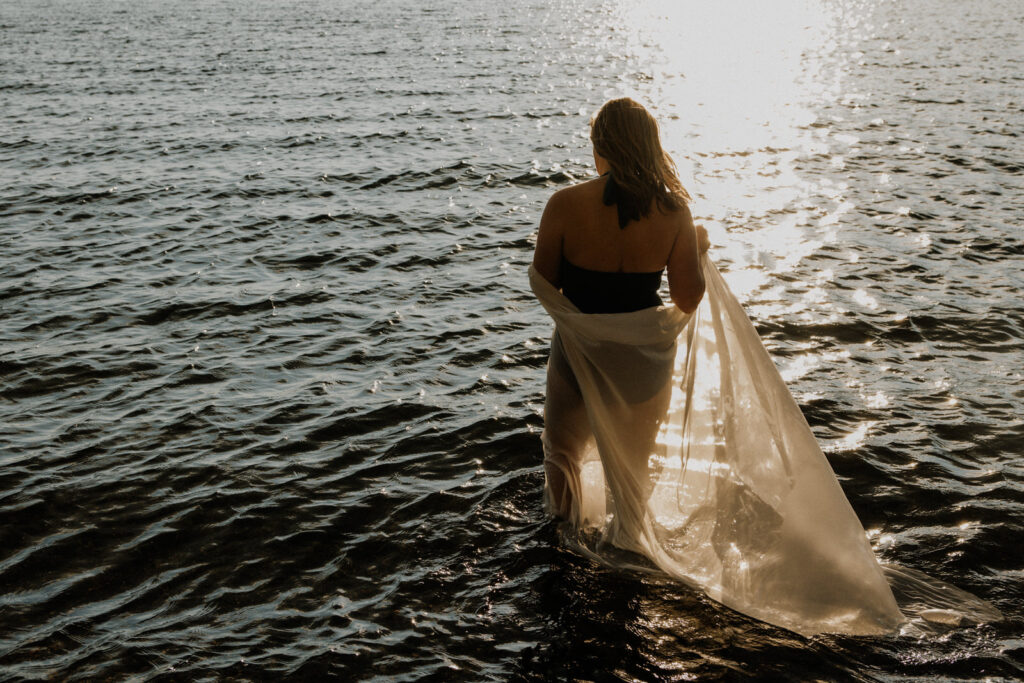 Portrait of a woman walking into the ocean taken by Vancouver Portrait Photographer Michele Mateus of Mateus Studios