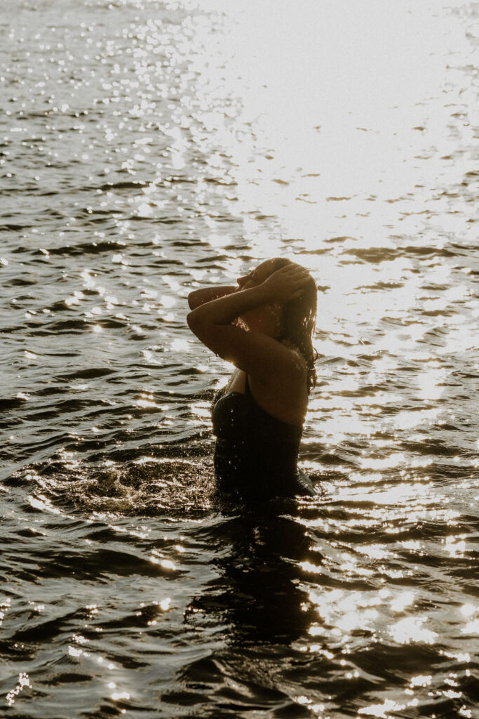 Vancouver Editorial Photographer Michele Mateus shows a portrait of woman in the ocean at Whytecliff Park Vancouver