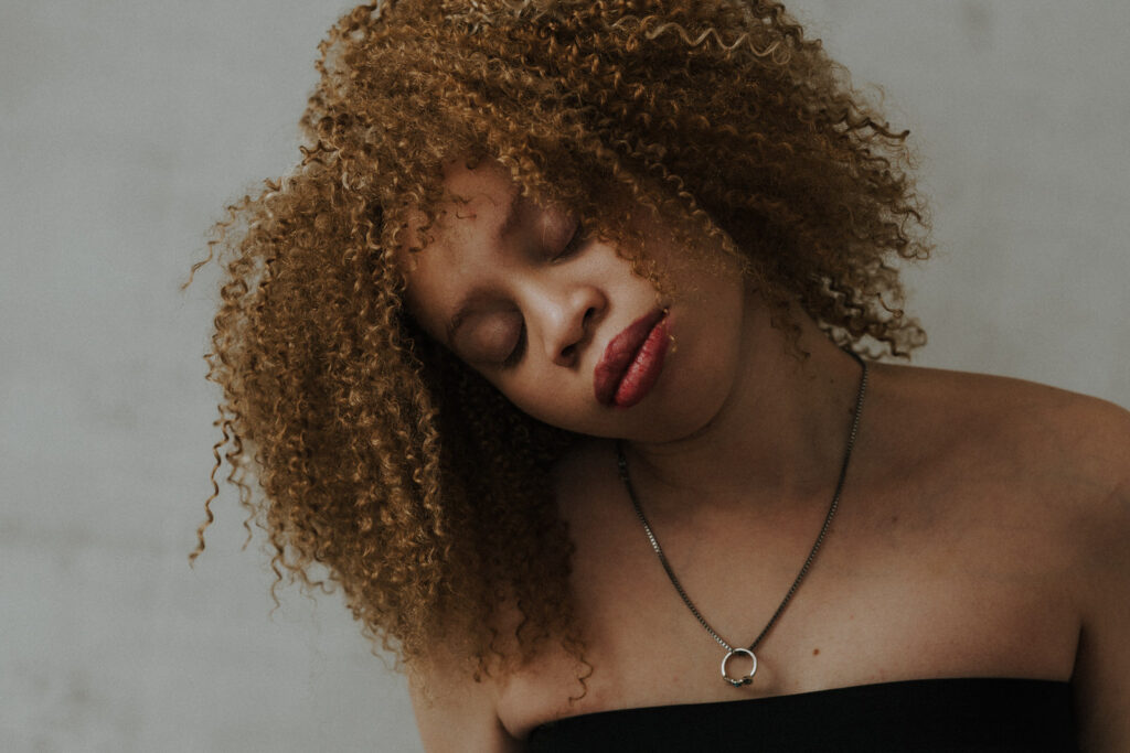 Portrait of a woman with albinism with red curly hair by Vancouver Portrait Photographer Michele Mateus