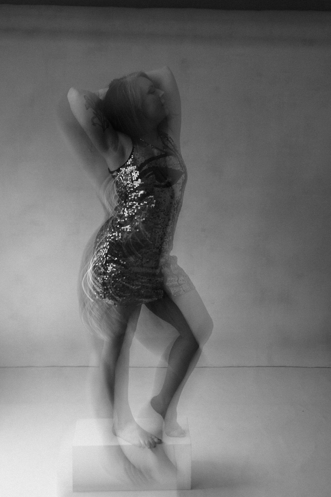Woman in flowing movement intimate black and white portrait