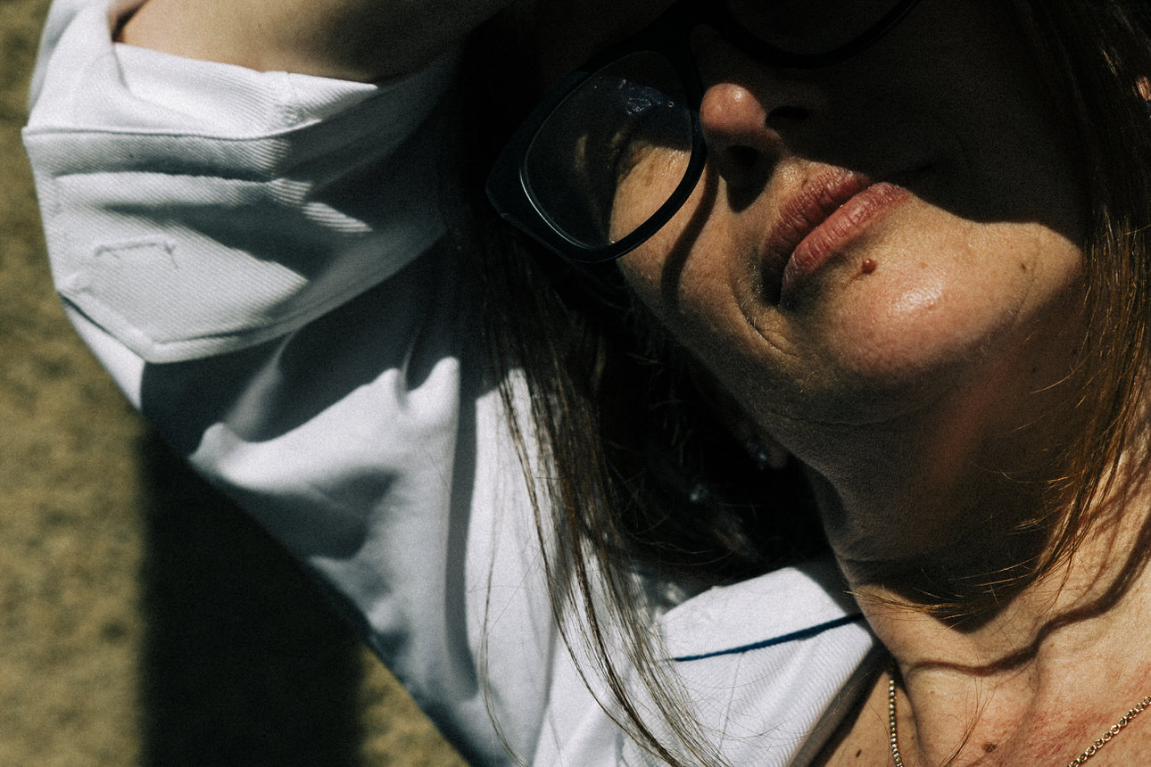 creative portrait of a woman with glasses in the sun by vancouver photographer michele mateus